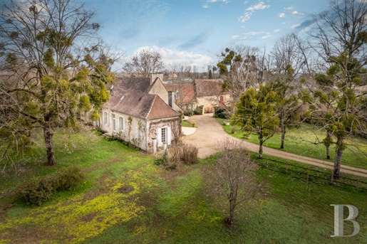 A country house with a swimming pool and a traditional Périgord dwelling, nestled in one hectare of