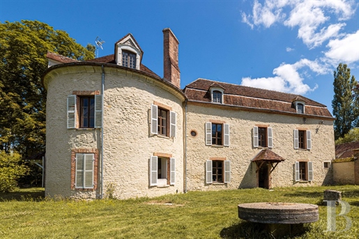 A restored presbytery, a mill, vestiges of a former fortress and converted outbuildings on grounds o