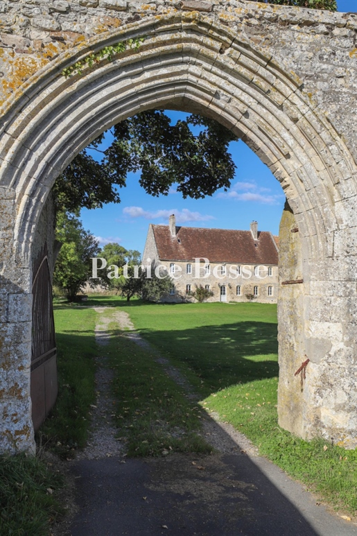 A 12th century priory, its listed church and its outbuildings set in almost 5 ha of land near Falais