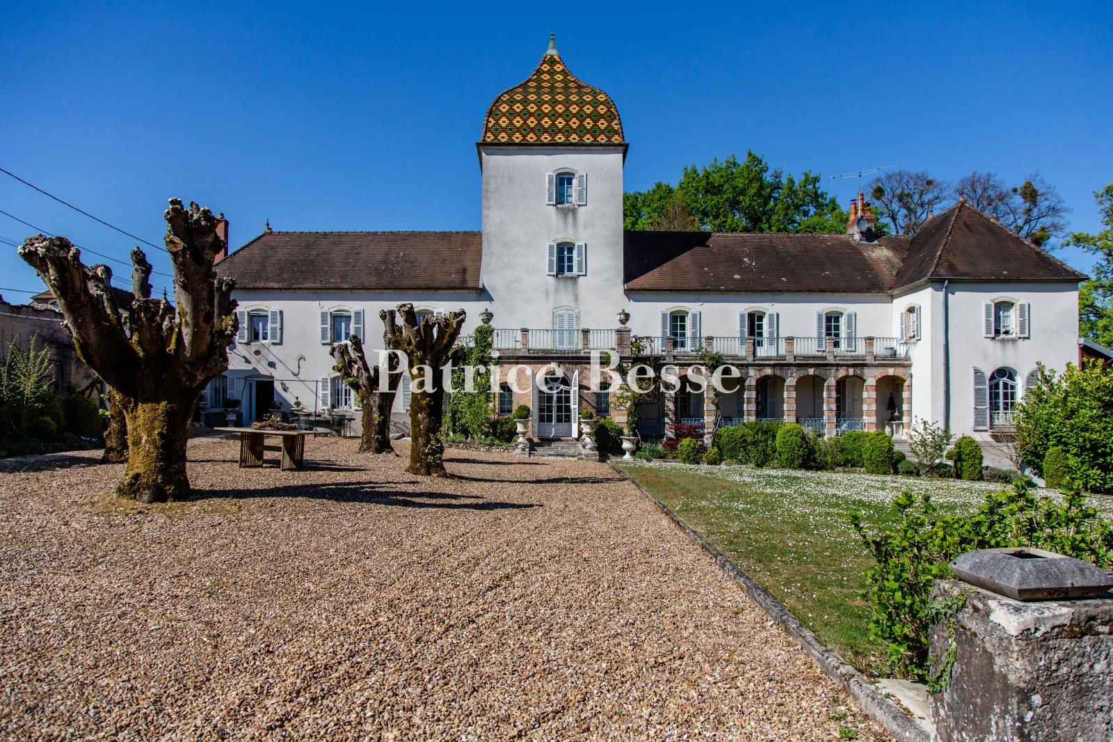 A 19th-century chateau with guest accommodations, swimming pool and grounds, perched along the banks