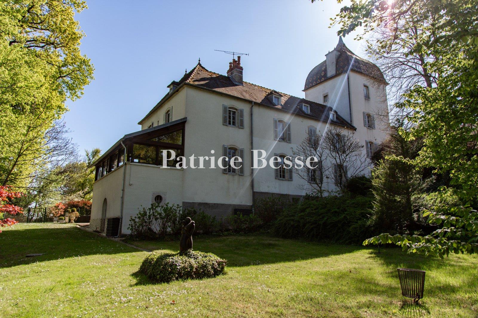A 19th-century chateau with guest accommodations, swimming pool and grounds, perched along the banks