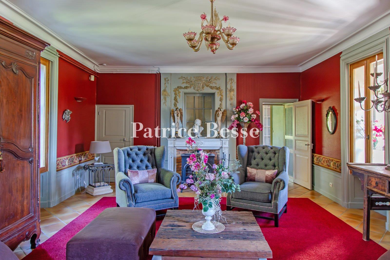 A 19th-century chateau with guest accommodations, swimming pool and grounds, perched along the banks