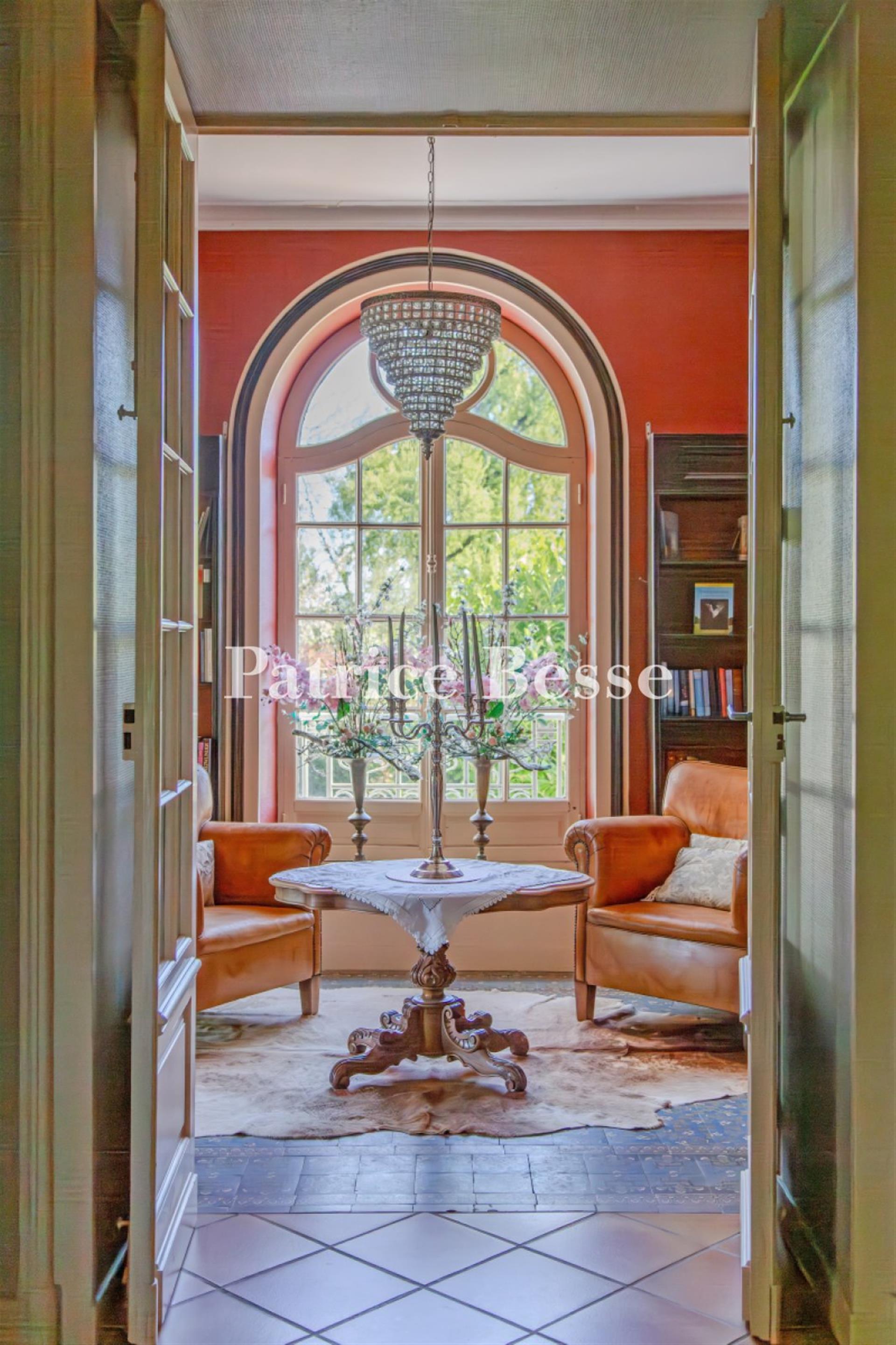 A 19th-century chateau with guest accommodations, swimming pool and grounds, perched along the banks