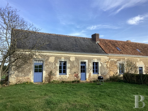 A restored 19th-century farmhouse with annexes and a garden in 3,400m² of grounds, nestled in France