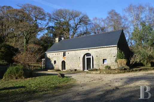 A 12-hectare property with wooded, undulating grounds edged by a river in France's Morbihan departme