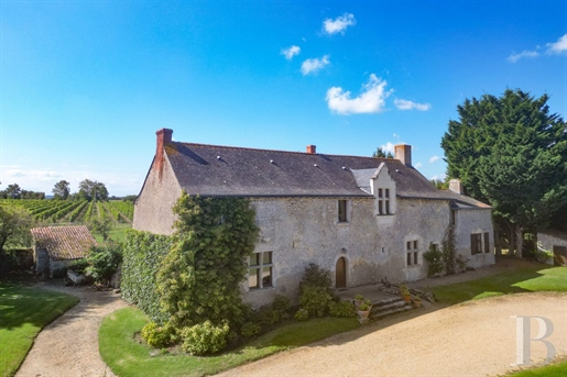 A 15th-century country house with annexe dwellings and outbuildings in 2 3 hectares of grounds with