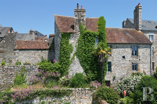 A dwelling with its listed 12th-century tower, set in a landscaped garden in a medieval town in the