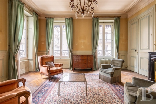 A large apartment in an elegant 19th-century edifice on Lyon's river peninsula, a stone's throw from