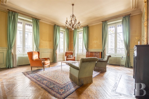 A large apartment in an elegant 19th-century edifice on Lyon's river peninsula, a stone's throw from