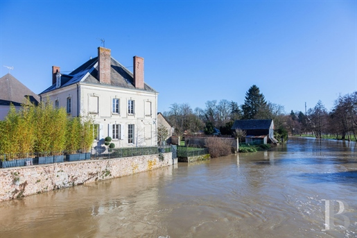 An affluent 19th-century house and its private mooring perfect for boating on the river Loir in a vi