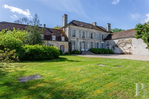 A beautiful property near Paris with vast, tree-dotted grounds, an 18th-century house and a 17th-cen