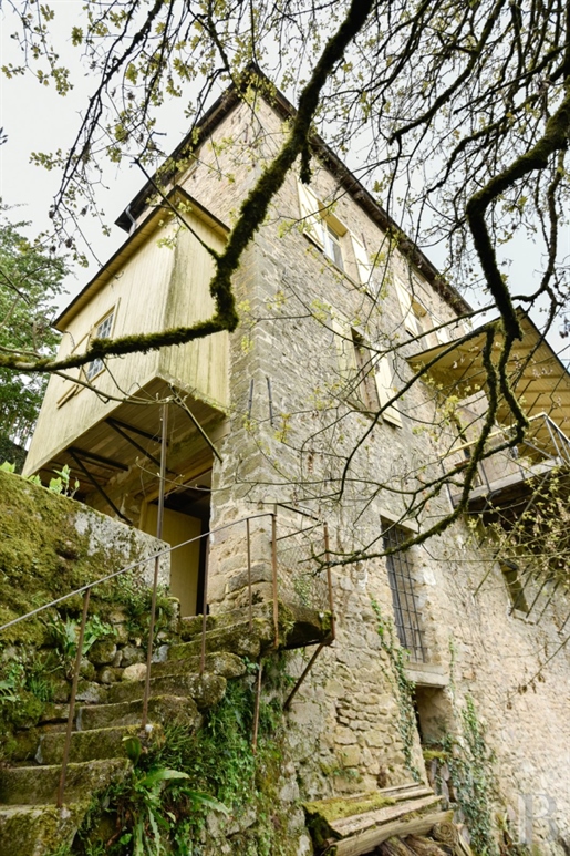 An original hillside house from the late 19th century, looking down at a river in France's Creuse de