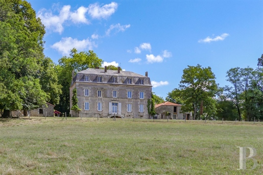 A 19th-century château in need of renovation, its outbuildings and pond on a 31-hectare estate in Ch
