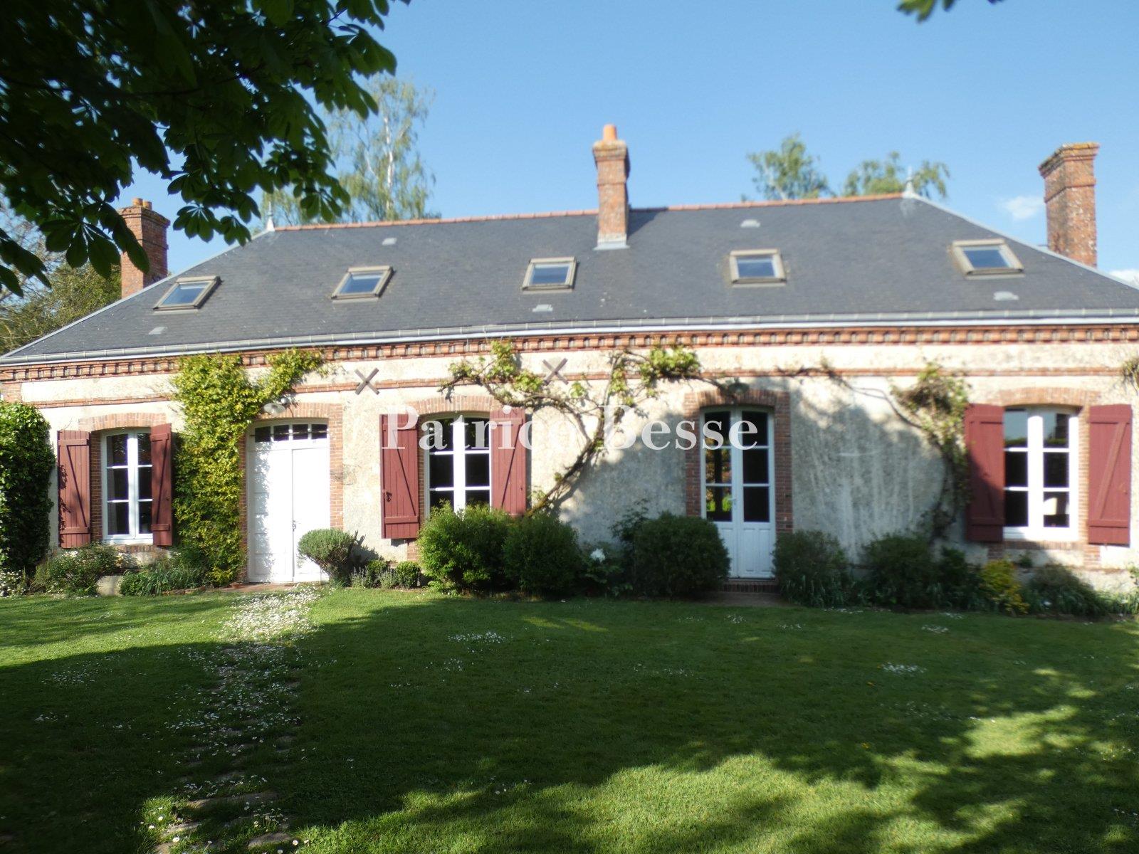 A charming renovated presbytery, its outbuildings, enclosed garden and views of the surrounding fiel