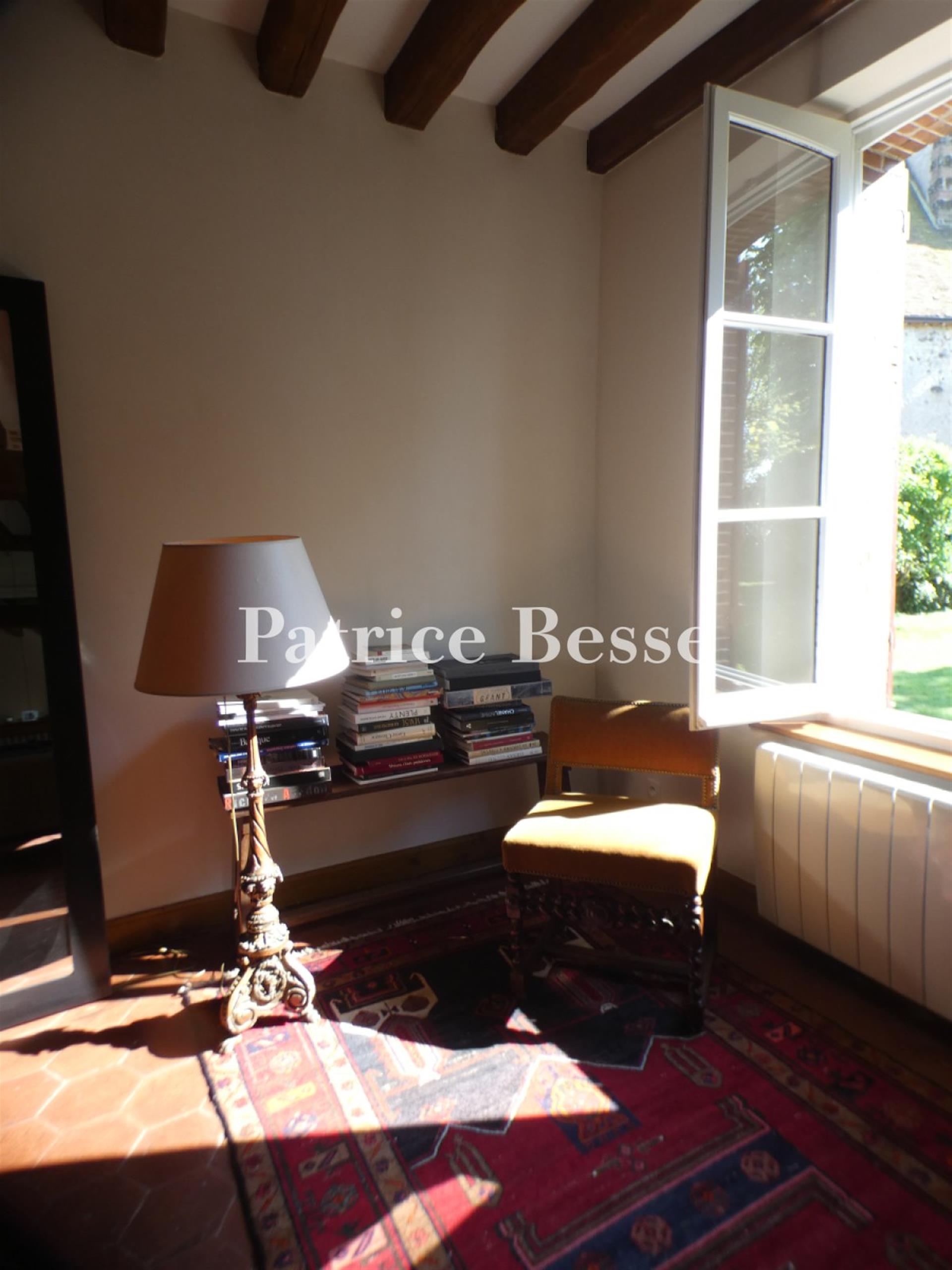 A charming renovated presbytery, its outbuildings, enclosed garden and views of the surrounding fiel
