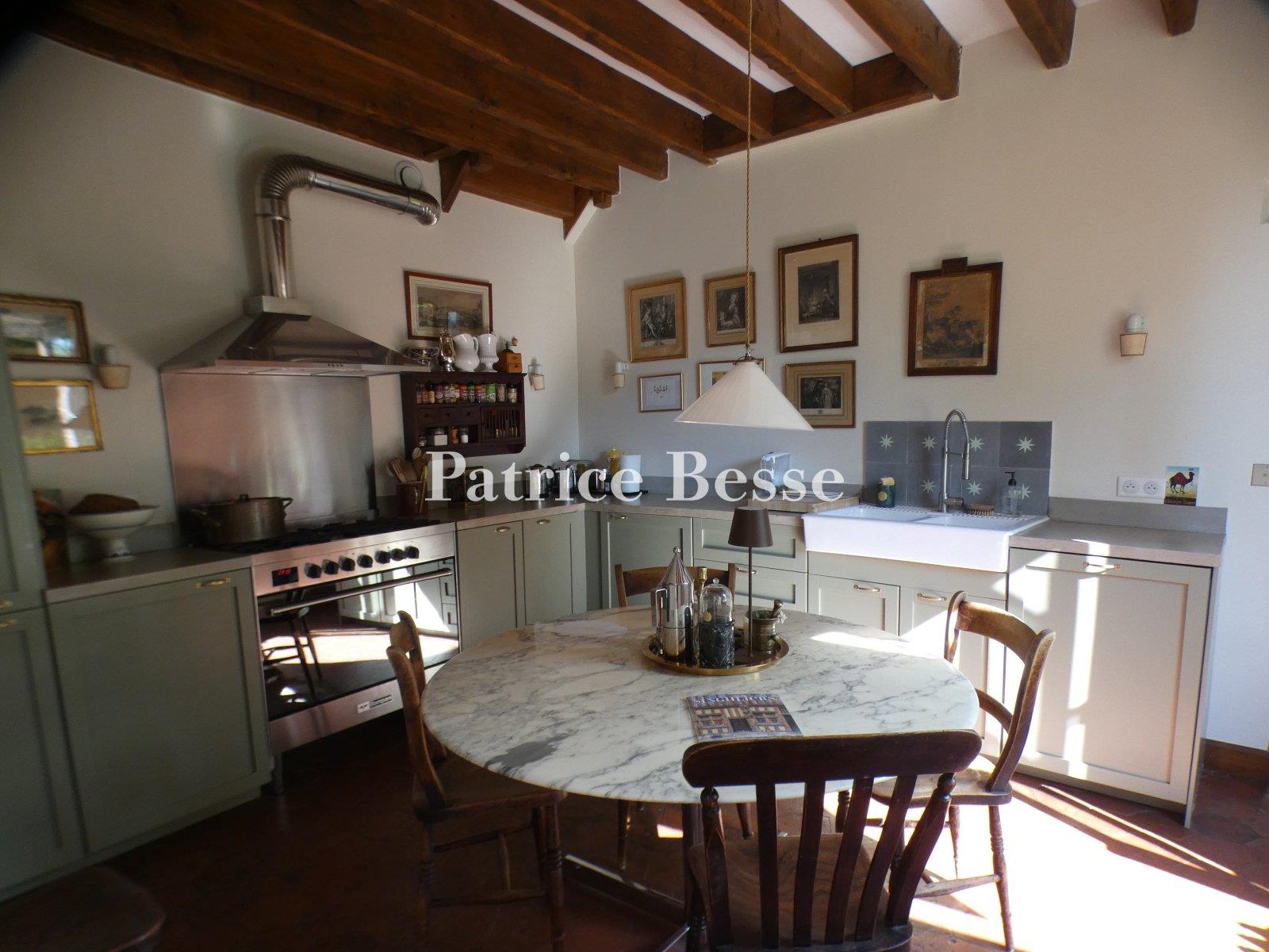 A charming renovated presbytery, its outbuildings, enclosed garden and views of the surrounding fiel