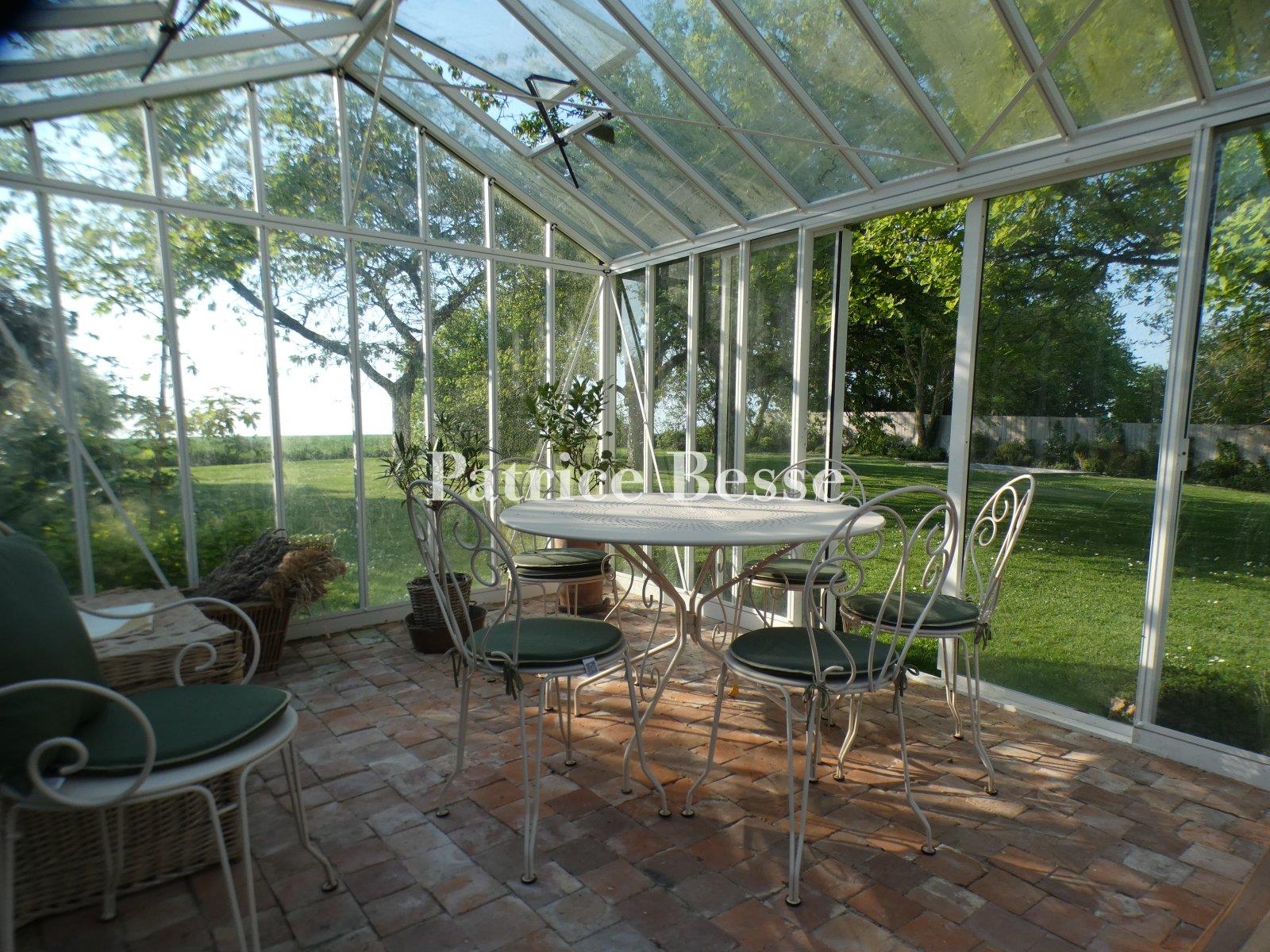 A charming renovated presbytery, its outbuildings, enclosed garden and views of the surrounding fiel
