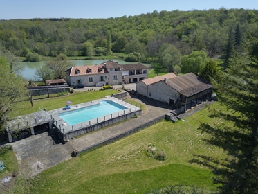 Imposing stone property with guest house, annex, outbuildings and swimming pool surrounded by a cres