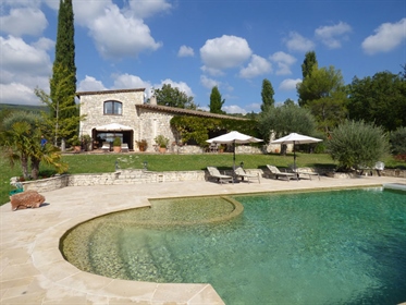 Situated on about 1,5 hectares of land, planted with olive trees, this stunning stone house, close t