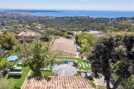 Above the charming yacht port of Golf Juan, in a sought after residential area, beautiful villa enti