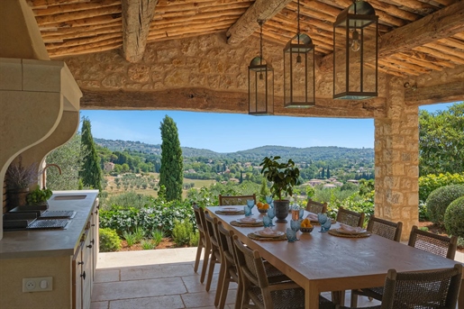 With sweeping panoramic views over the olive groves below and a glimpse to the sea, this extraordina