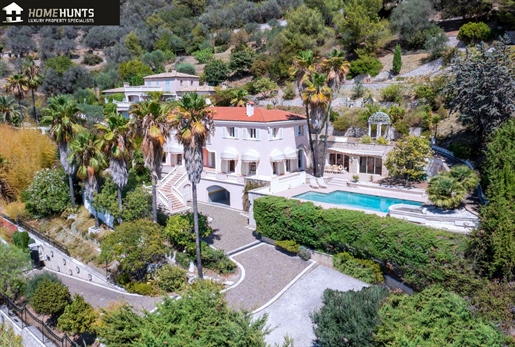 Prestigious house with panoramic view of the Baie des Anges set in mature landscaped grounds.
