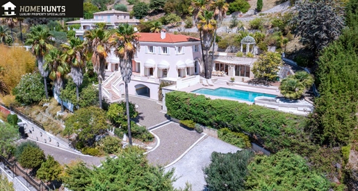 Prestigious house with panoramic view of the Baie des Anges set in mature landscaped grounds.
