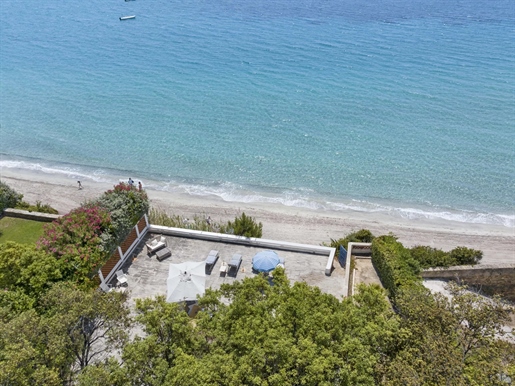 With direct access to a fine sandy beach through a private gate, this unique property benefits from