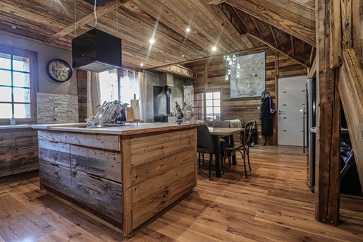 Magnificent 19th century farmhouse, lovingly renovated to showcase the old wood and original roofing