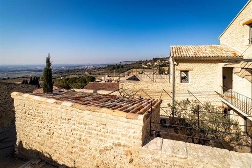 Superb stone property for sale with swimming pool, in the center of a village in Provence, and at th