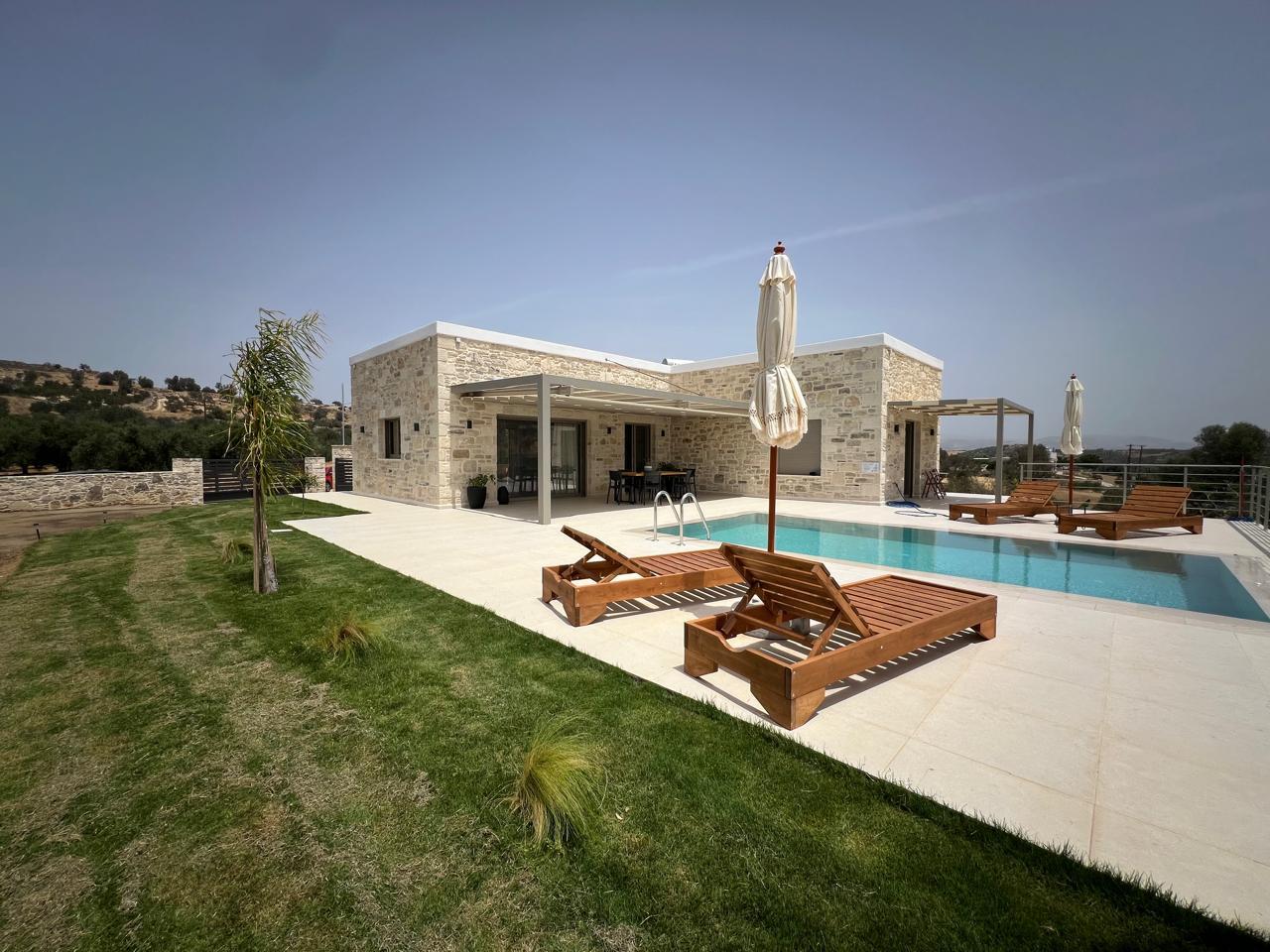 Modern villa sourrounded by olive trees