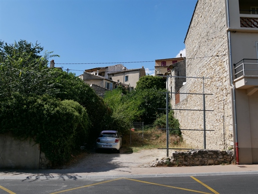 Land with house in dilapidated condition in town center