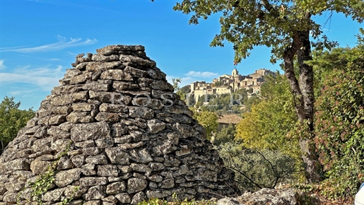 Gordes – maison en pierres en position dominante à 2 pas du village.