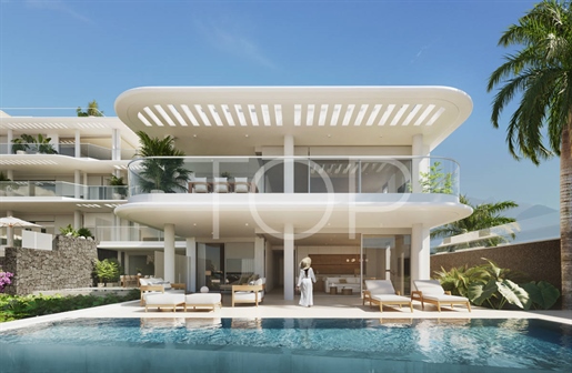 Exclusivo apartamento con jardín y piscina privada de tres dormitorios en primera línea de Playa San