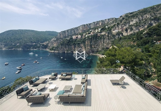 Waterfront property with panoramic sea view and direct access to a private beach with a pontoon