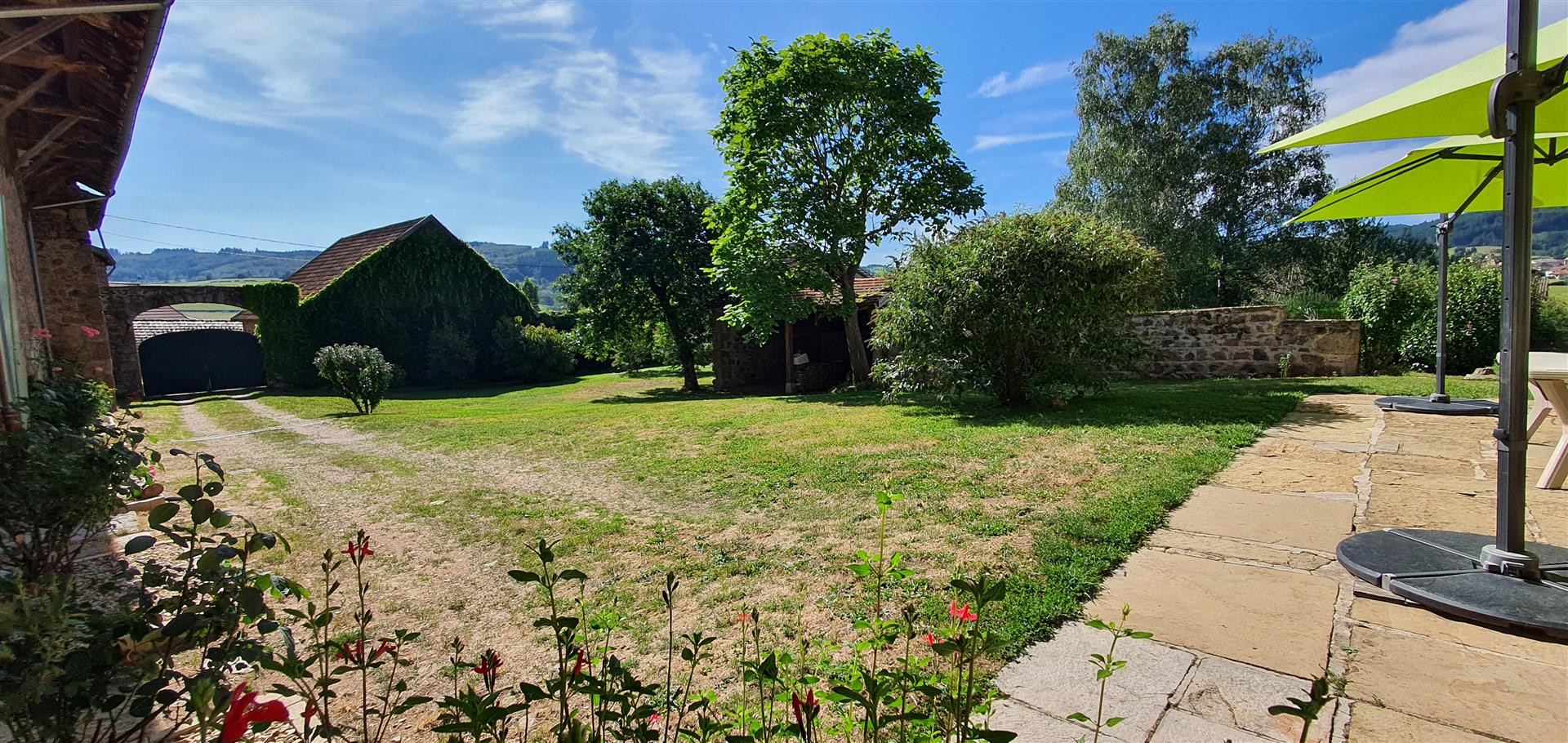 A privately situated, recently restored farmhouse on the edge of a large village, with garden and po