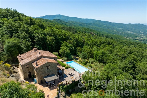 Restored country house with pool overlooking the Valle di Chio in Tuscany