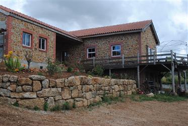 Beautifully renovated, natural stone farmhouse in a quiet rural área near Tábua town, where you can 