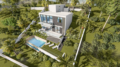 Casa de obra nueva de moderno y atractivo diseño, con jardín y piscina, a 5 minutos de cala Canyelle