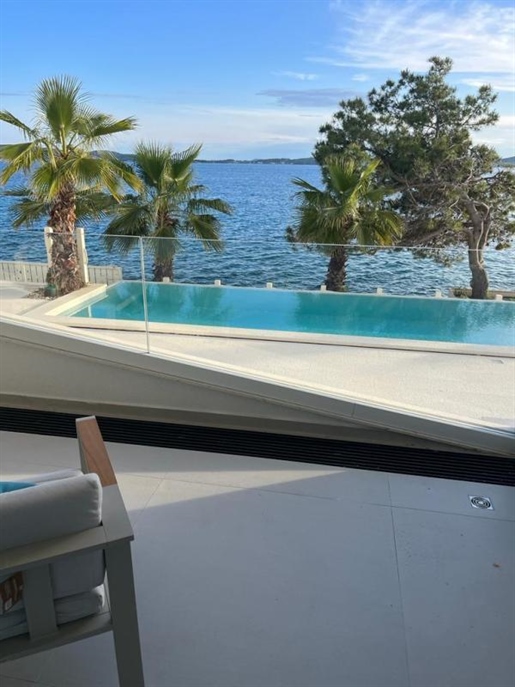 Luxurious apartment first row to the sea near Zadar, in the residence with swimming pool facing the