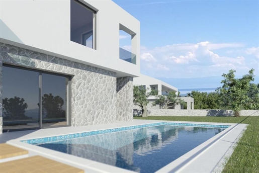 Modern house with pool under construction and sea view
