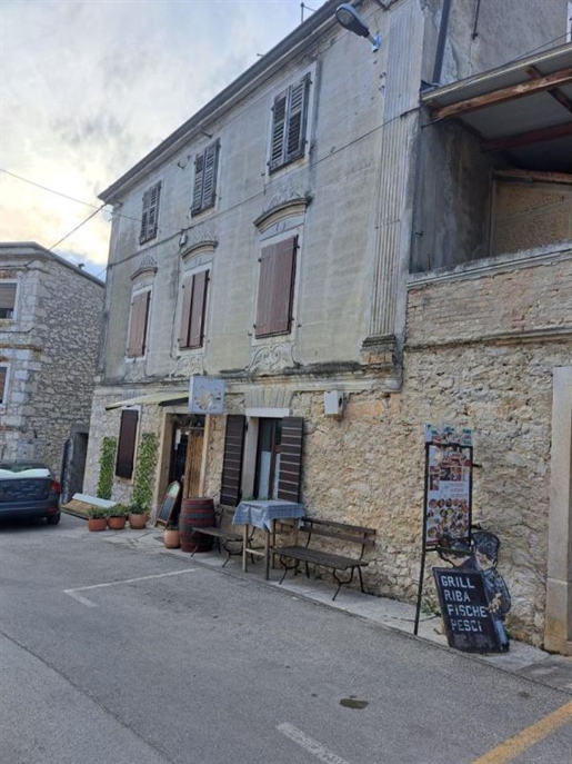 Stone house with several apartments in Brtonigla