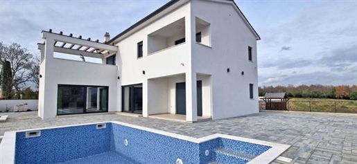 Modern villa with swimming pool in Marčana with distant sea views
