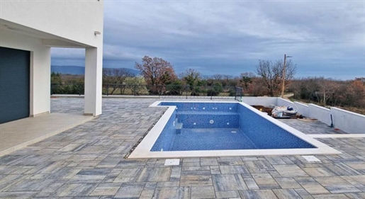 Modern villa with swimming pool in Marčana with distant sea views