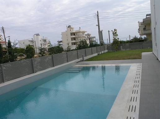 Luxury apartment with private garden and swimming pool for sale in Glyfada, Golf.