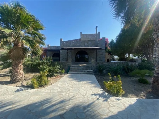Paros, Naoussa: For sale a stone-built luxury villa in the meadow of Naoussa built in 2001 with a to