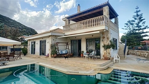Exceptional furnished villa for sale in Porto Rafti . Located 300m from the seaside on a total plot