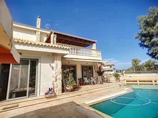 Exceptional furnished villa for sale in Porto Rafti . Located 300m from the seaside on a total plot
