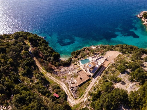 Beachfront Villa -Maisonette for sale in Syvota with a "private" small beach in front of it