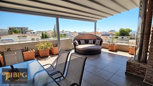 Exclusive maisonette with panoramic sea view in Athens Riviera. The two level maisonette offers 250